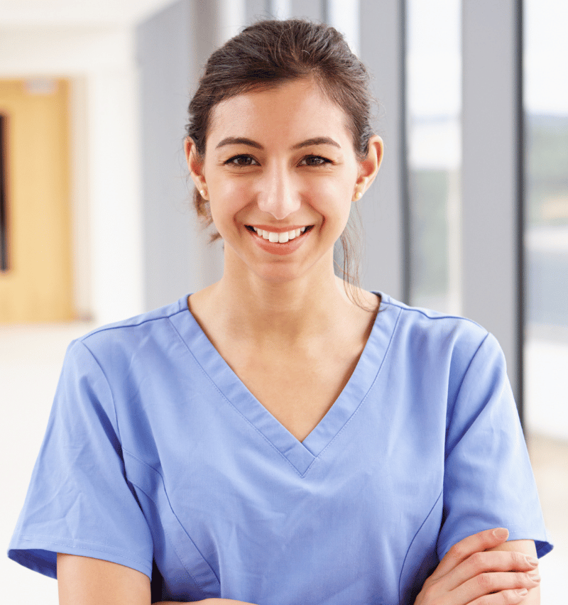 Female disability care nurse smiling at camera