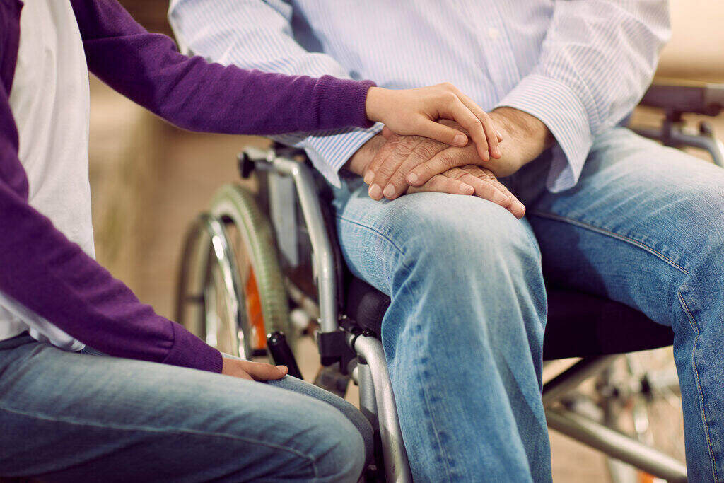 Person in wheelchair with carer